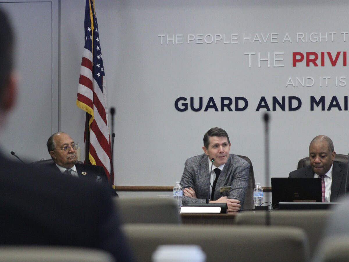 brad briner at the head of state board of education table